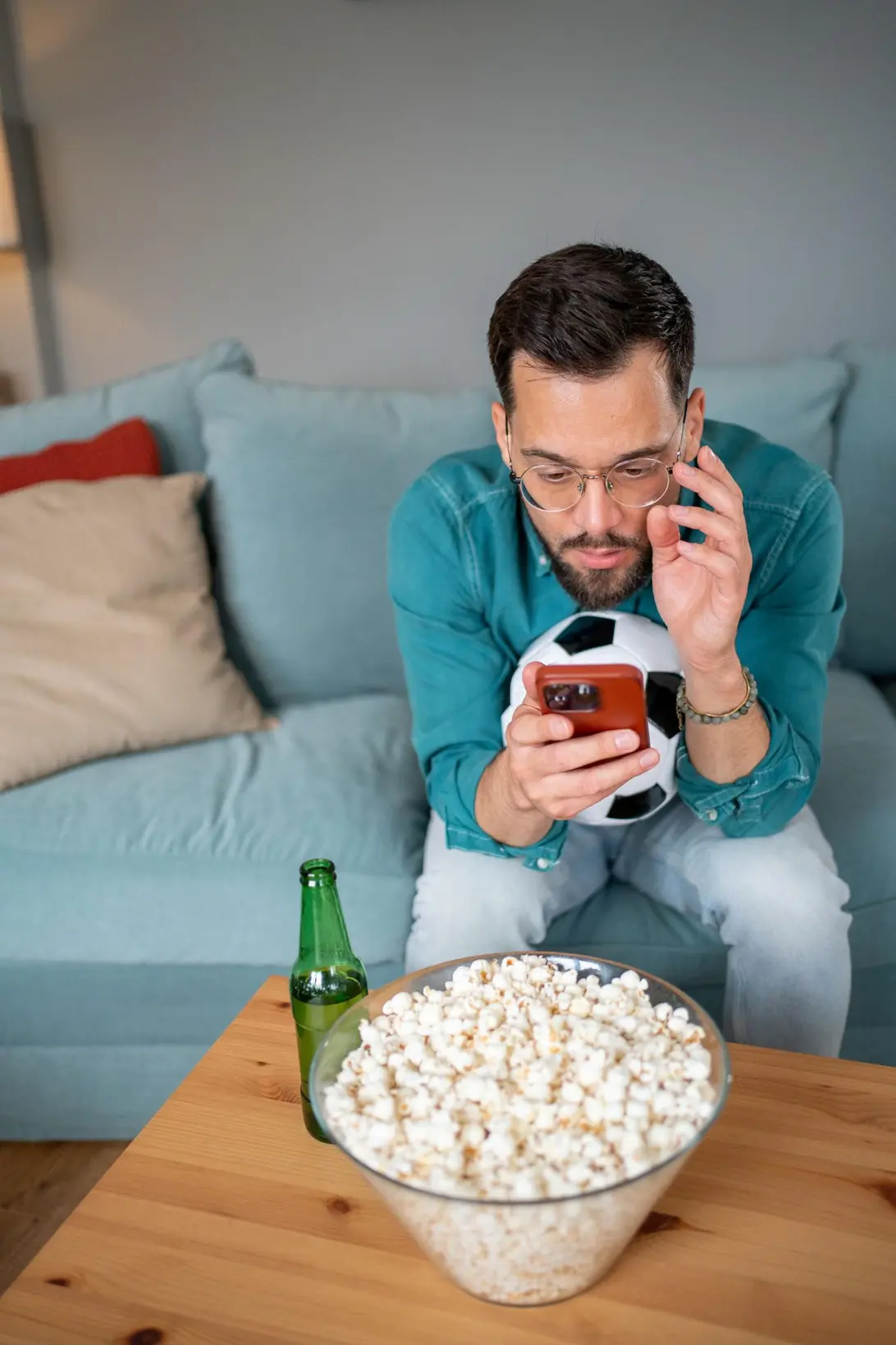 football fan watching match at night alarm reminder mobile schedule tracking concept